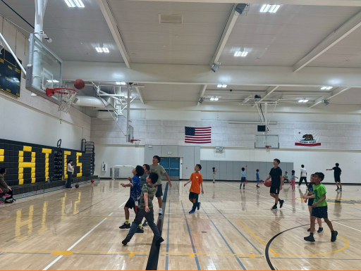 Kids playing basketball in the gym at Peterson Middle School